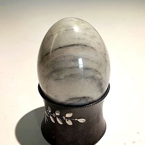 China Jade Crystal Egg on Black and Silver Cradle